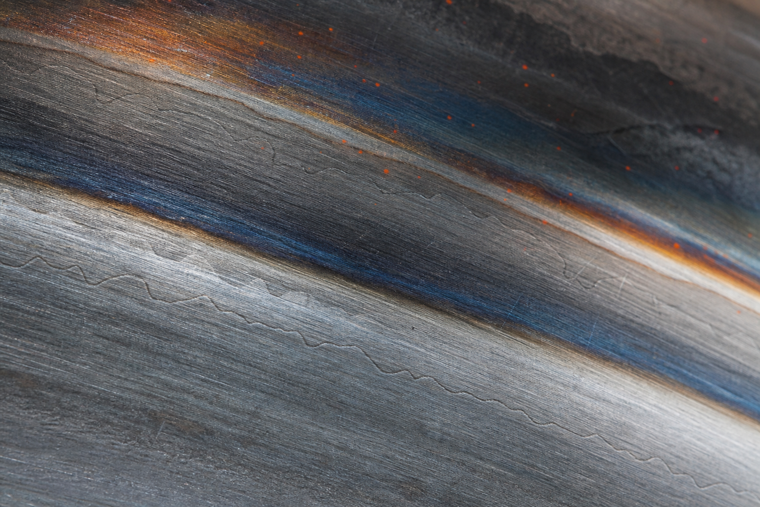 Tempered steel surface detail representing durable digital infrastructure